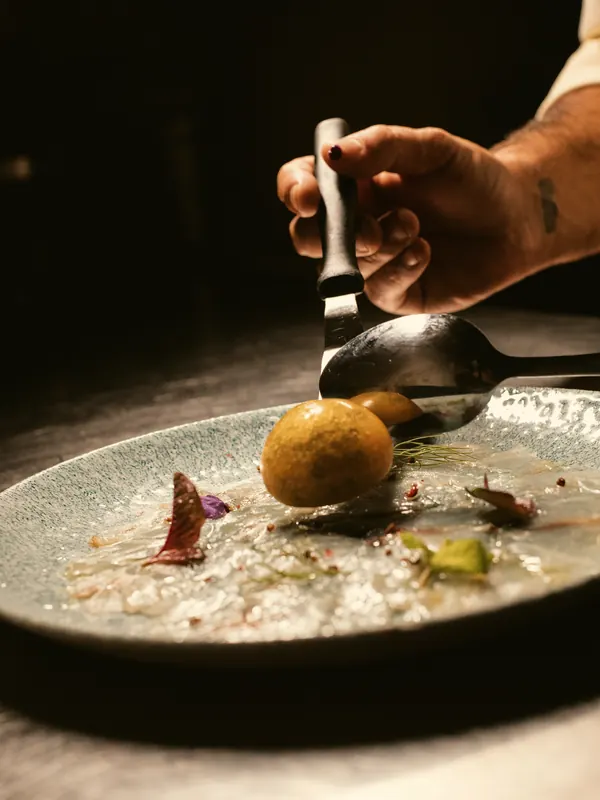 A golden crab croquette in a pale velouté