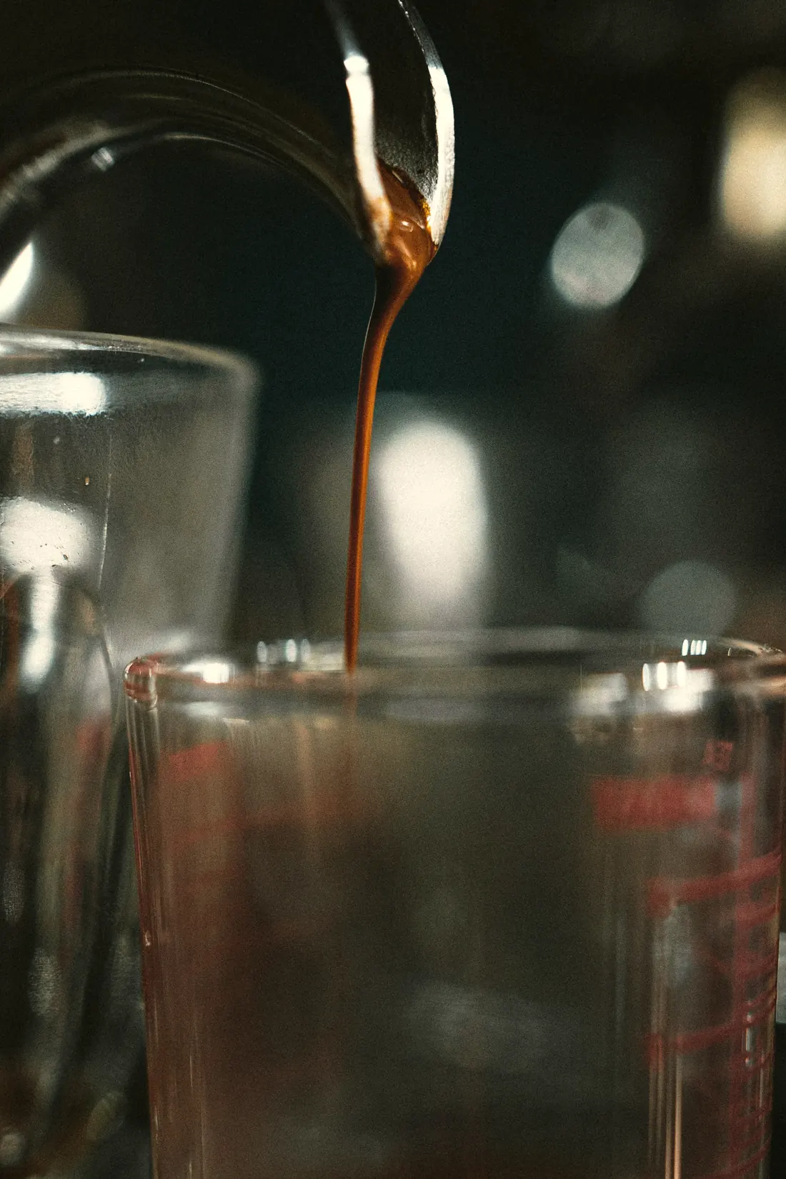 An amber pour falling into a glass